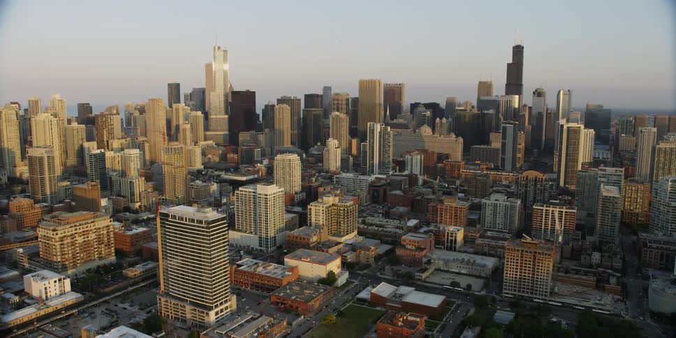A large city has many tall buildings on a cloudy day