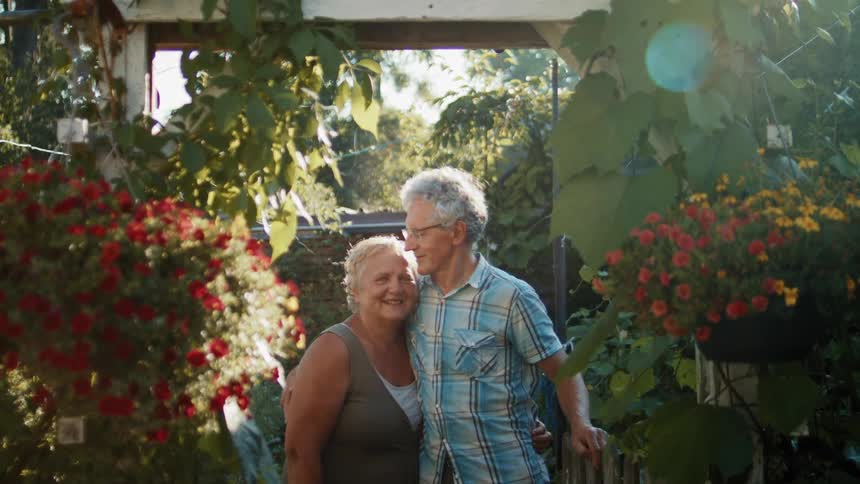 A couple hug in the garden