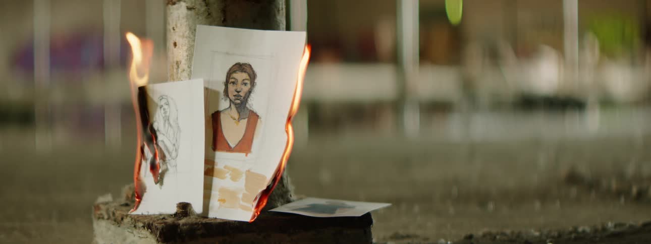 A paper of drawings burning with fire