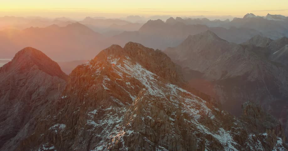 A snowy mountain range with many peaks