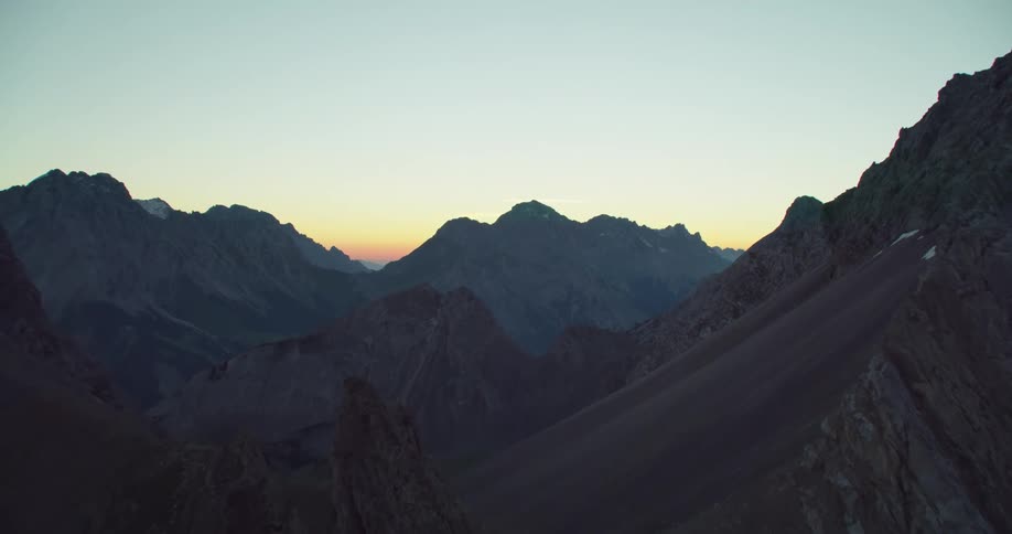 Aerial view of a mountain range is displayed