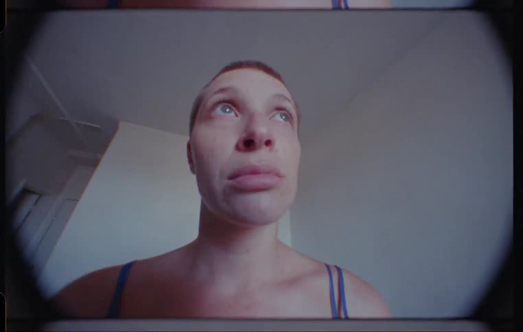 Caucasian woman looks up at the ceiling