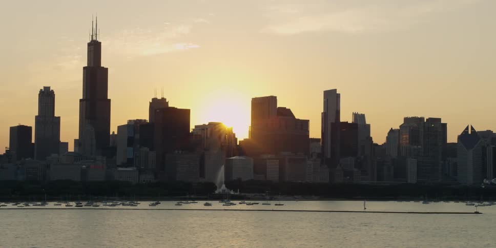A large city is seen at sunset