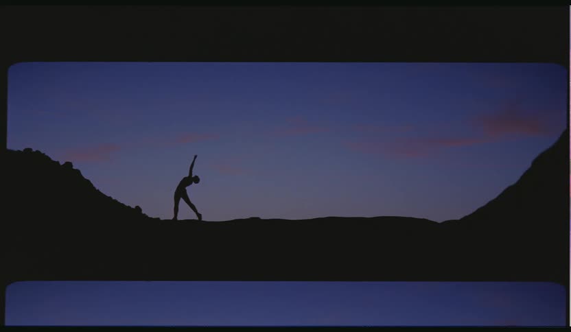 A woman doing yoga outside