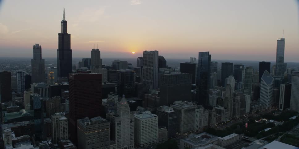 Aerial view of a large city at sunset