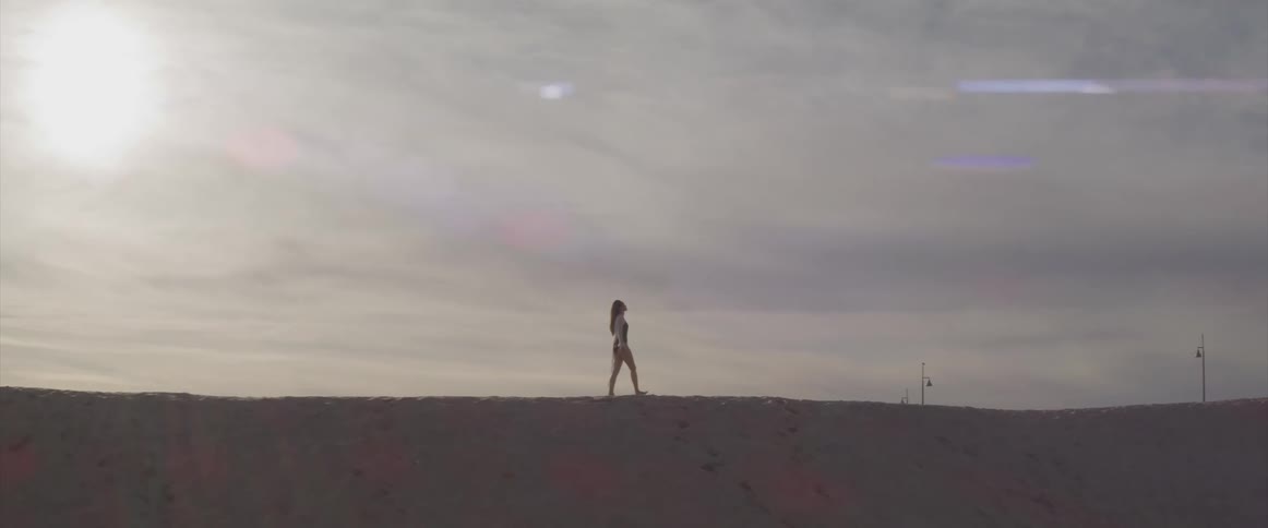 A woman walking on the beach