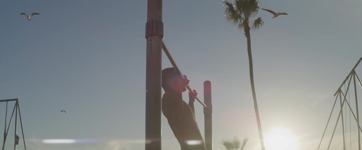 Working out at the beach on pull up bar