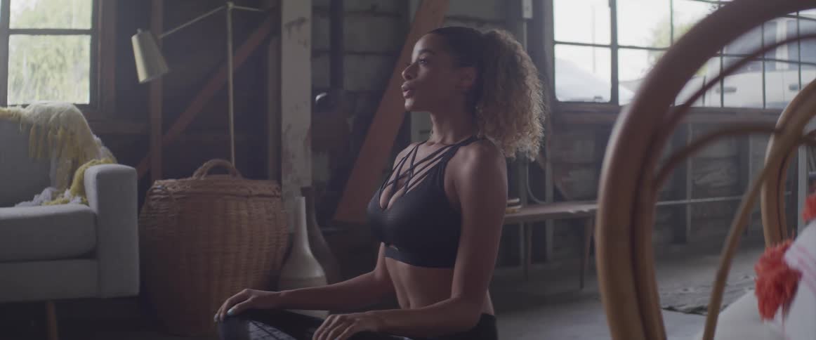 A woman is doing yoga indoors