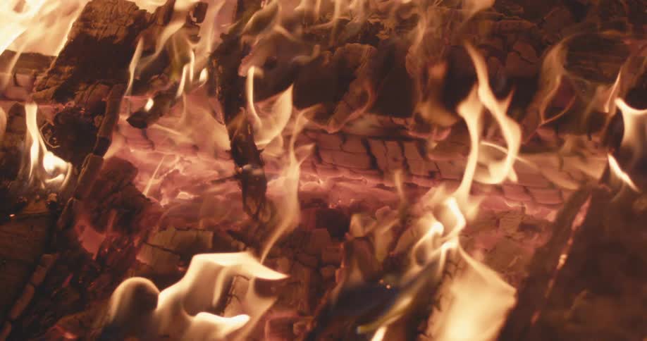 Flames rising from wood in a bonfire