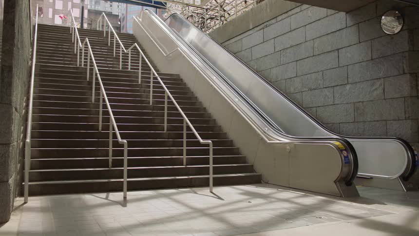 A person is walking down a staircase