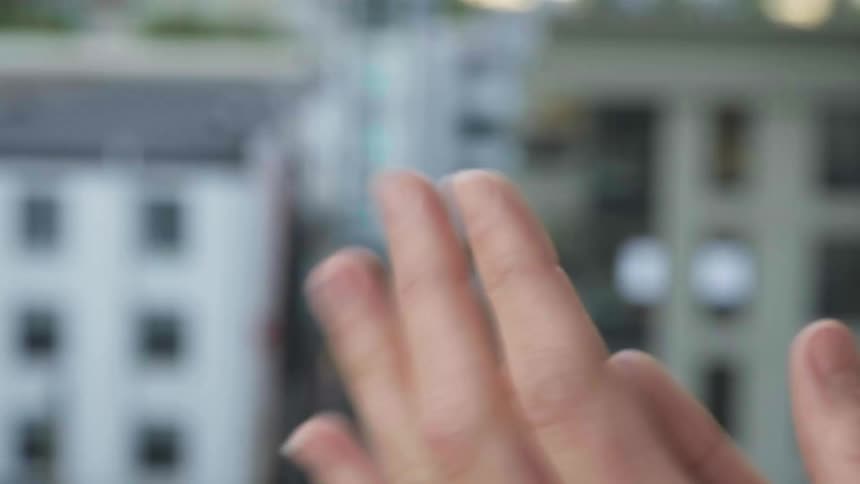 A man claps his hands together