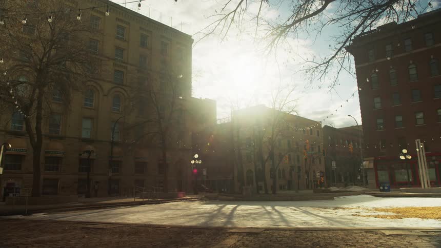 Sunlight shines over a downtown city area