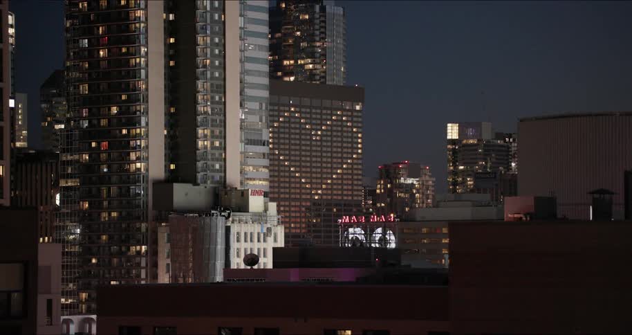 City lights illuminate the night sky in an urban area