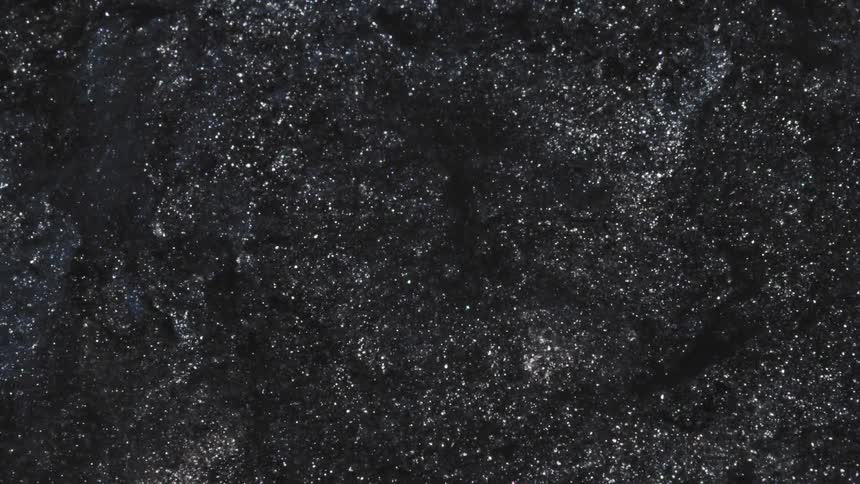Black white and gray colors that look like soil and snow