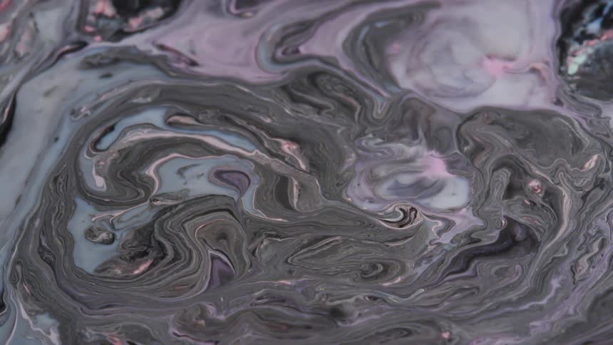 Movement of black blue and pink liquid