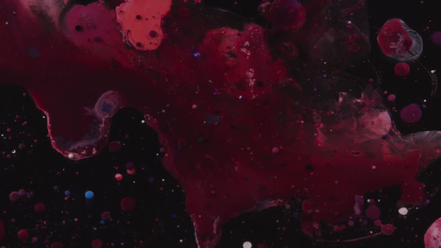 A close up of flowing red liquid