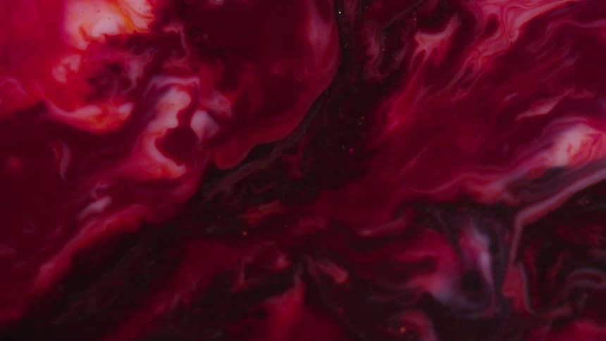 Abstract colorful red paint ink liquid diffusion psychedelic with movement