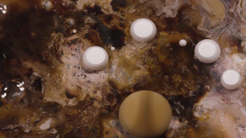 White and brown paint droplets
