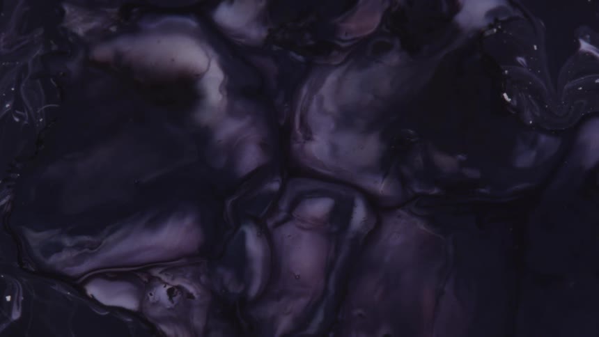 Purple dye is combined with white paint to create a gradient pattern