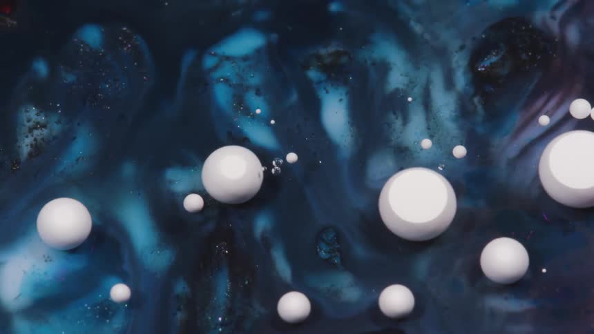 Abstract colorful white and blue paint ink liquid diffusion psychedelic with movement