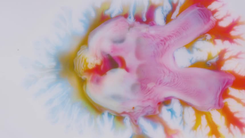White yellow pink orange and blue colors that look like oil and water