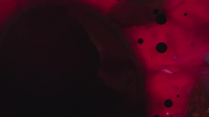 Close up of flowing red and black liquid