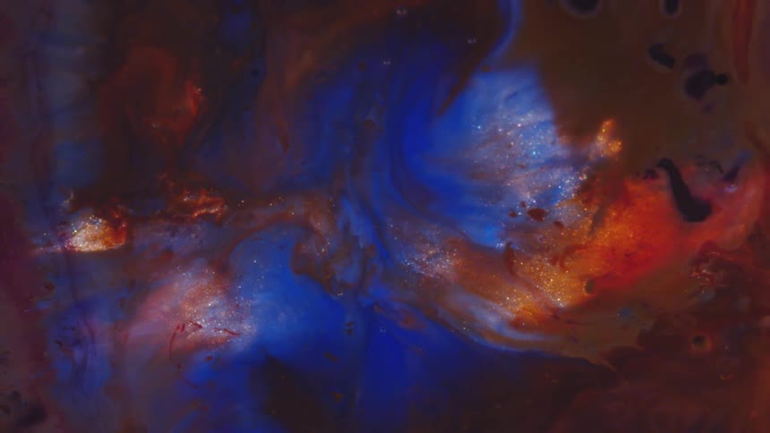 A blue and red liquid slowly flows and mixes together