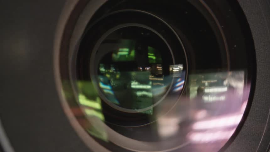 Light reflects off the center of an attachable camera lens