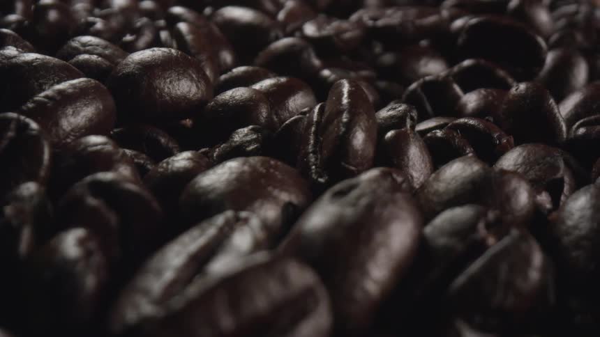 A close up of a pile of roasted coffee beans
