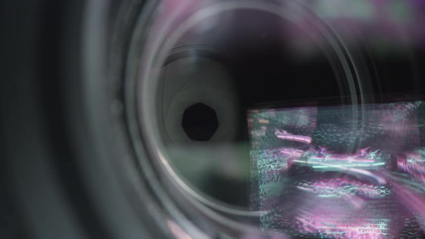 An eye being examined behind a lens