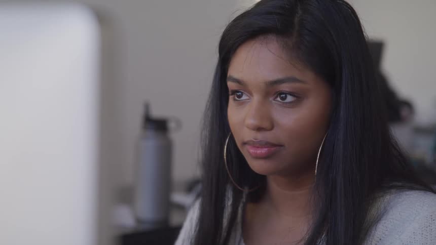 Young woman working on a computer in the office