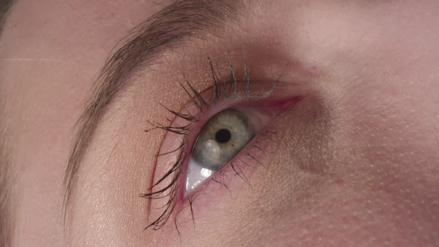 A person blinks their one eye