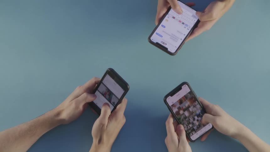 People use their cell phones together