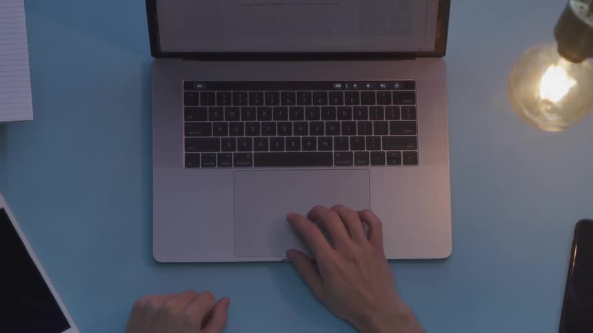 A person is typing on a laptop