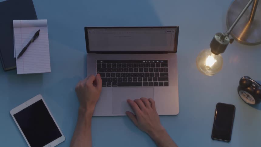 A person is typing on a laptop