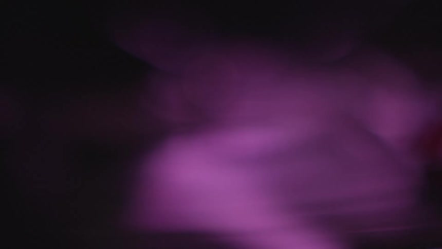 A bright purple light shining
