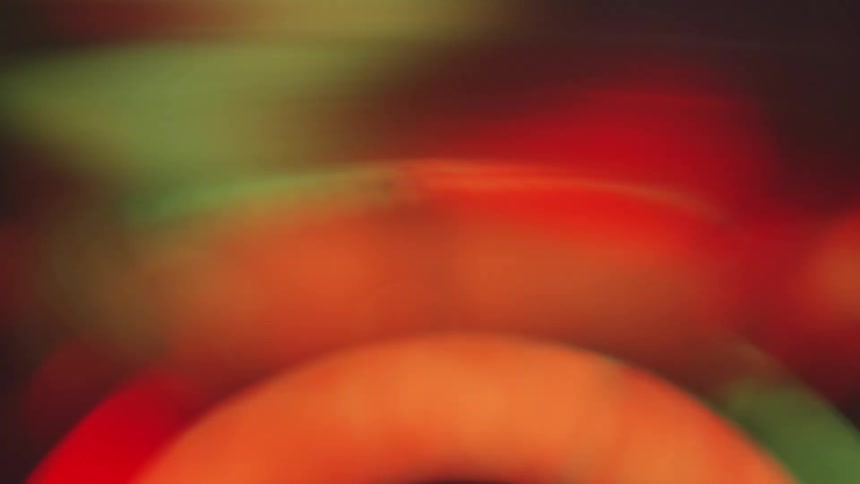 Black green and red colors that look like lights and shapes