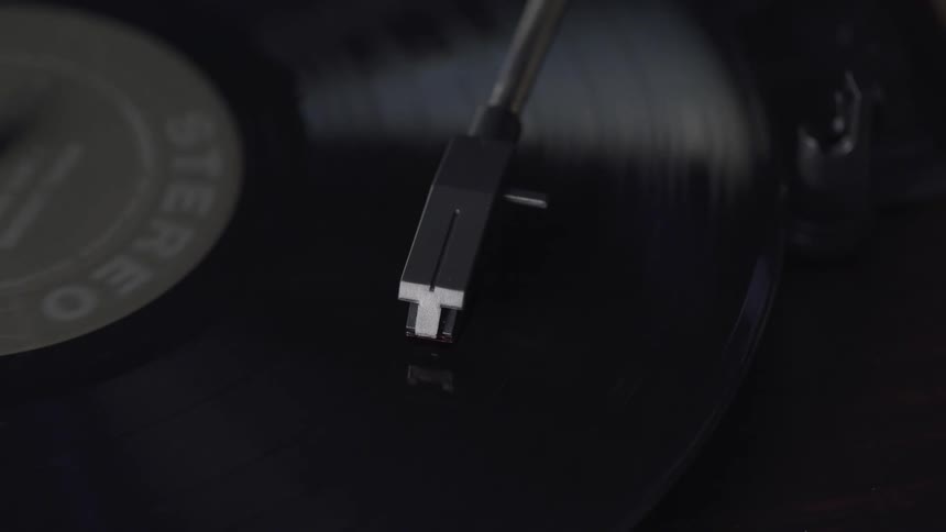 An album spinning on a record player