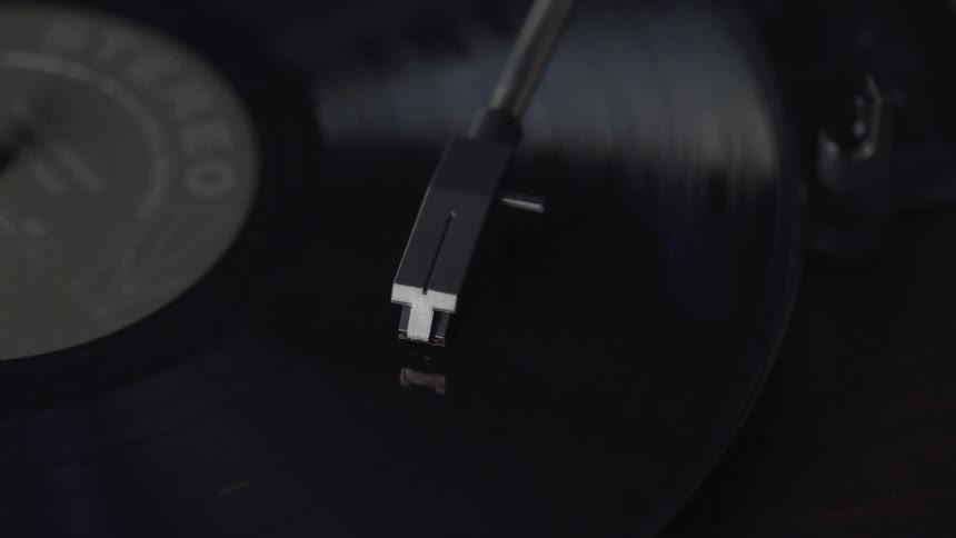 An album spinning on a record player