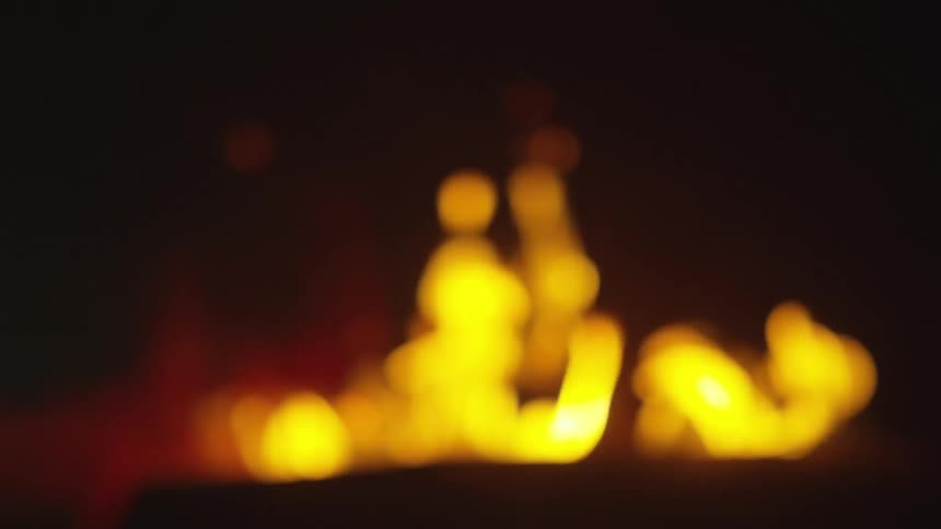 A fire is burning at night