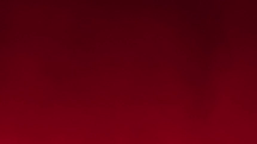 A red haze blows to the left