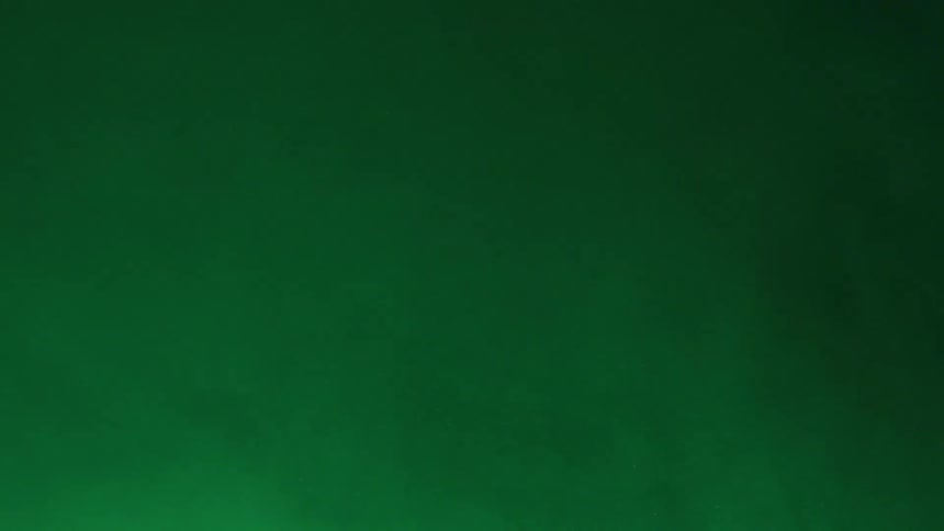 Paler green smoke flows over deeper greens