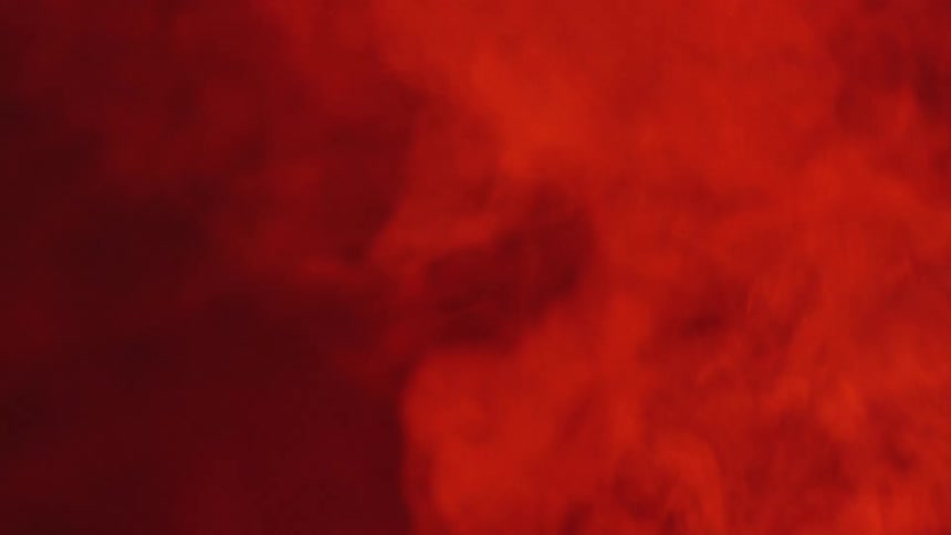 Red smoke fills the room