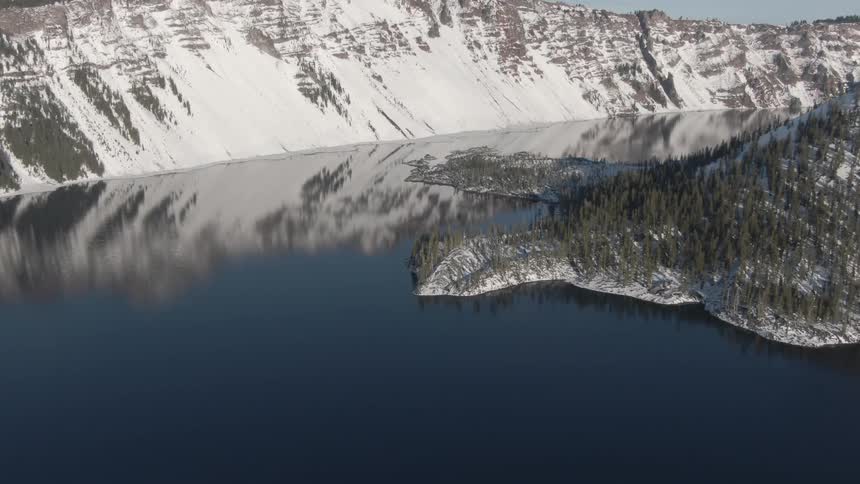 The mountains reflect on the water