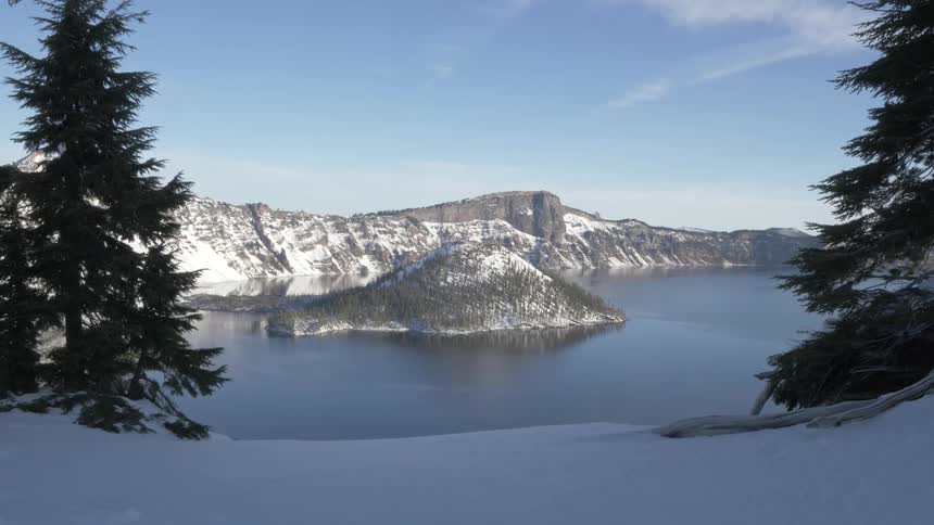 A mountain is displayed near a body of water