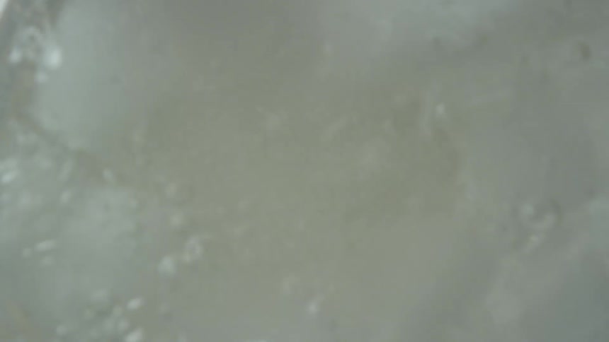 The glass is being filled with seltzer water