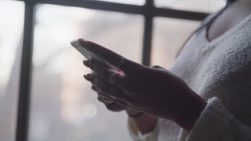 A young woman using her cell phone
