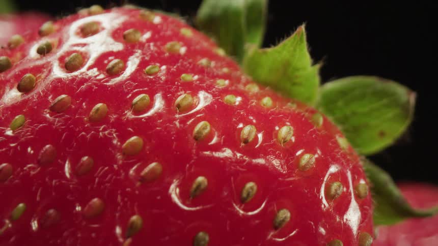 A closeup view of a strawberry is displayed