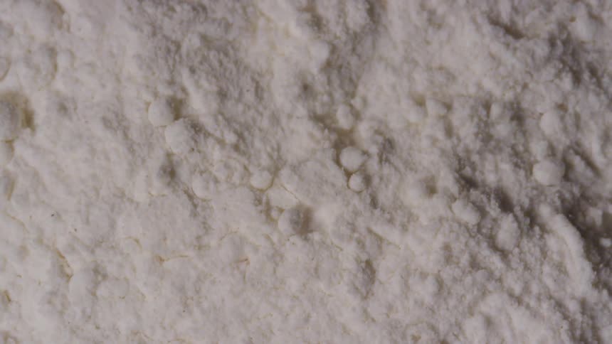 White powdery substance vibrating over a surface
