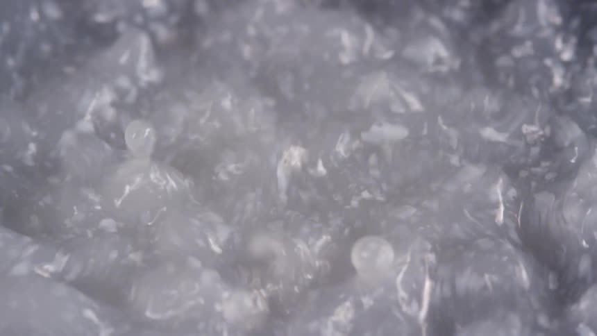 Close up of bubbling boiling liquid surface